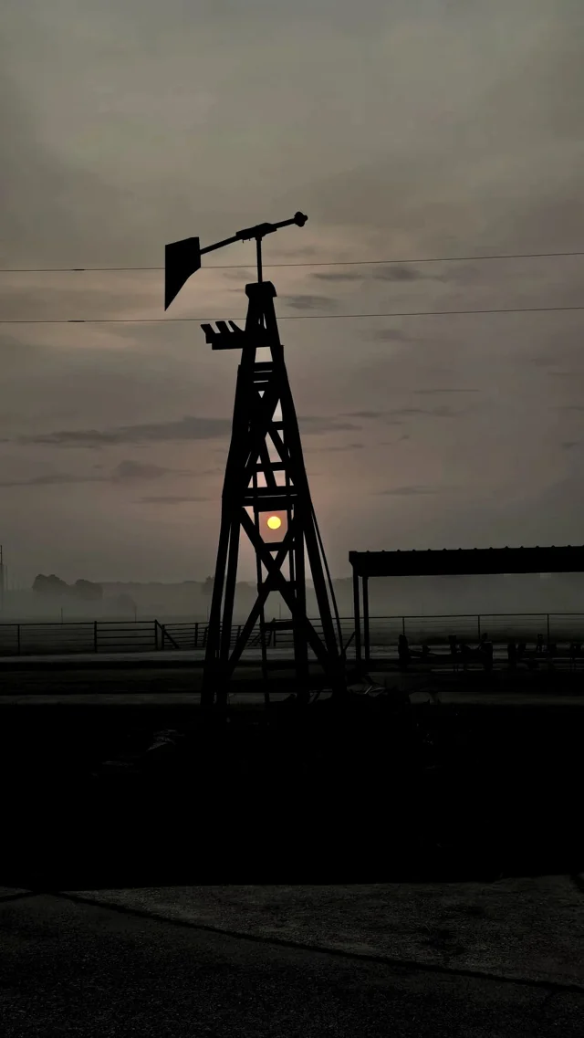 Sunrise in the fog, through the windmill