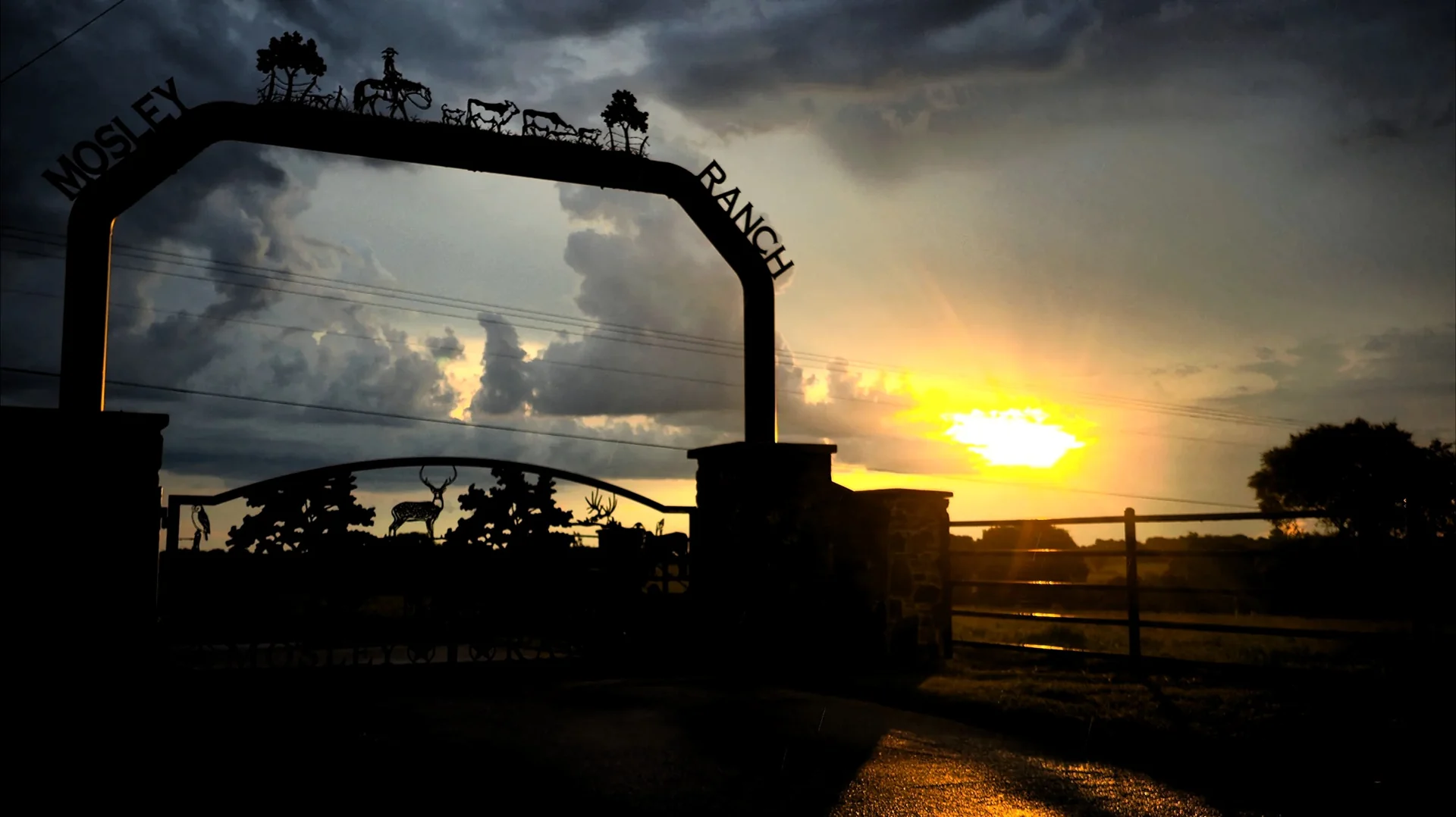 The gate, with the sun going down behind it