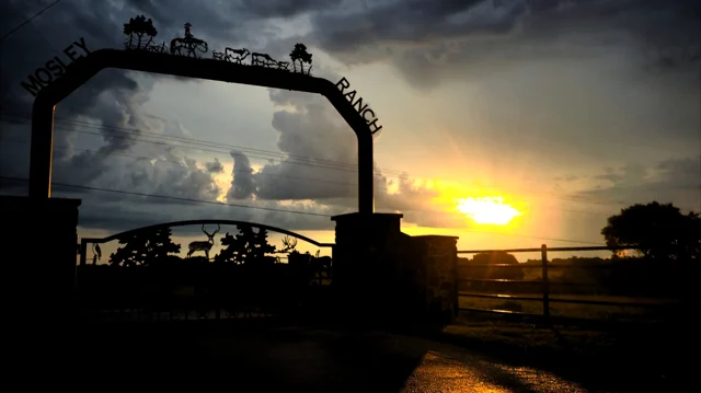 The gate, with the sun going down behind it